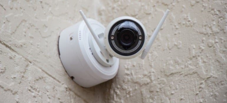 A security camera mounted on a wall.